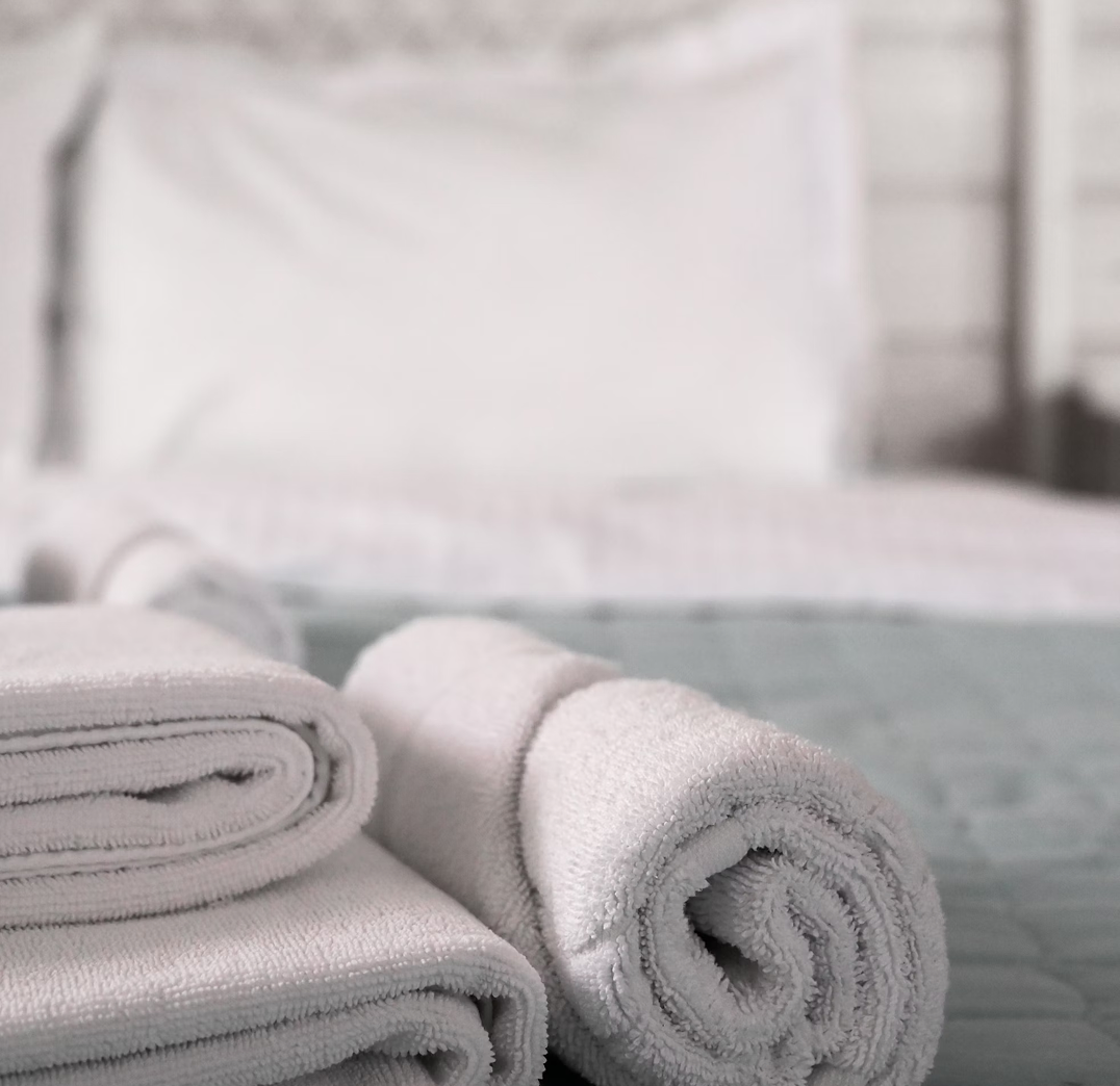Photo of clean white towels and linen